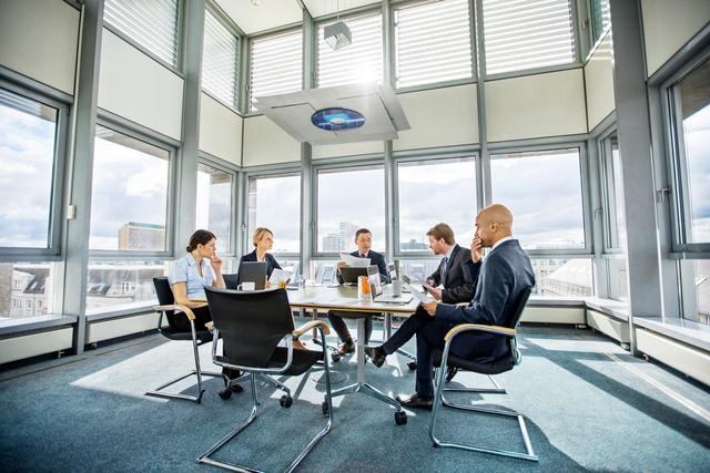 Board members using Diligent Boards to enhance efficiency and board management